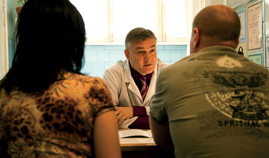 Dr. Igor Skuratovsky counsels an HIV-positive couple at a clinic in Odessa, Ukraine.