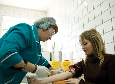 A nurse administers an HIV test